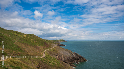 The Welsh Coastal path, winding its way around a headland on the Gower peninsular, on a sunny, spring day