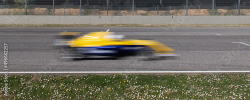 Race car speed blurred motion on asphalt racetrack competition concept