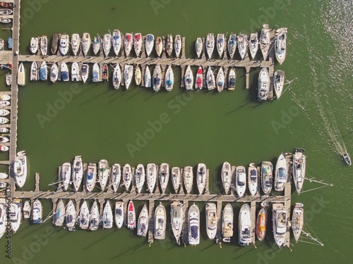 Aerial view of Kingswear and Dartmouth, Devon, with boats moored on piers on the river Dart, England.