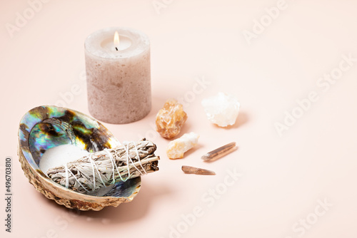 Smudge kit with white sage, palo santo, abalone sea shell. Natural elements for cleansing environment from negative energy, adding positive vibes. Spriritual practices, witchcraft concept