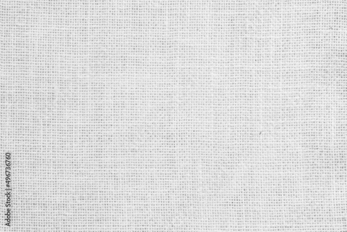 White fabric jute hessian sackcloth canvas woven gauze texture pattern in light white color blank decoration.