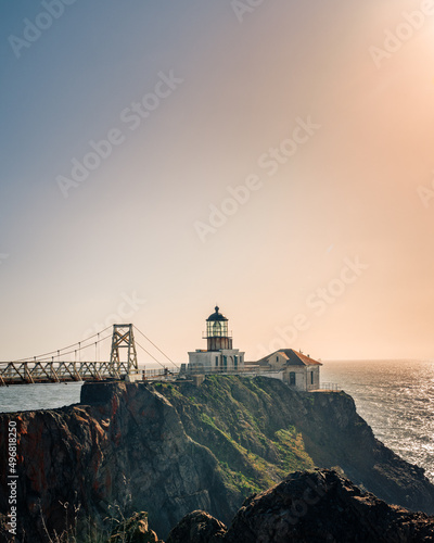 Vertical shot of the Point Bonita Lighthouse at sunset in San Francisco.