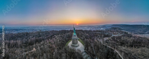 Panoramic view of the Hermannsdenkmal monument on a hill at the sunset in Detmold, Germany