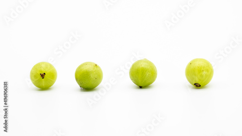 selective focus, gooseberry in a row isolated on white background, Amalaki