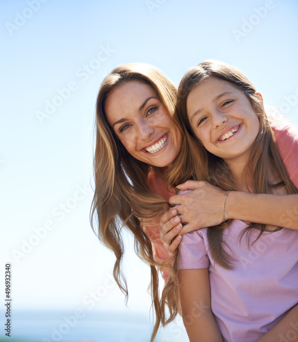 Holiday love and affection. Portrait of a loving mother and daughter standing together in the outdoors.