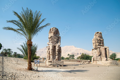 The Colossi of Memnon. Giant stone statues representing Pharaoh Amenhotep III during the 18th Dynasty of Egypt, in front of the Egyptian city of Luxor.