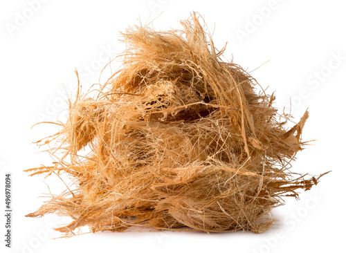 pile of coconut husk fiber or coir, commercially important natural fiber extracted from outer husk of coconut fruit,isolated on white background