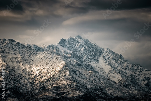 The snow capped peak of Monte Grosso in the Balagne region of Corsica