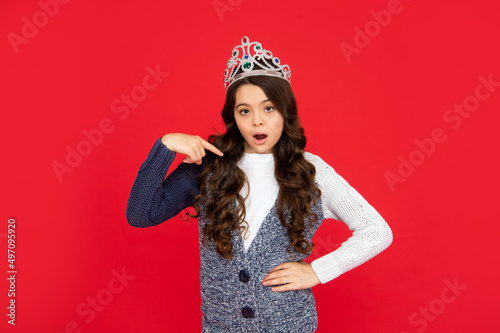 selfish child in crown. self confident queen. expressing smug. arrogant princess in tiara.
