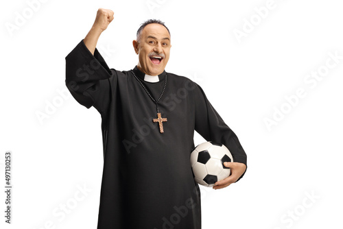 Happy priest football supporter holding a ball and cheering