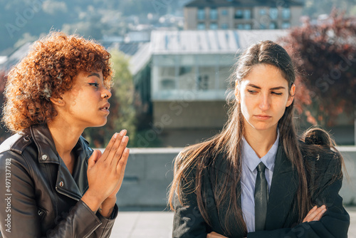 girl apologizing or sorry to her friend