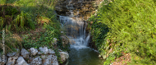 Artificial waterfall. Waterfall image for park and city landscape.