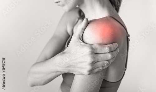 woman with pain in their shoulder joint