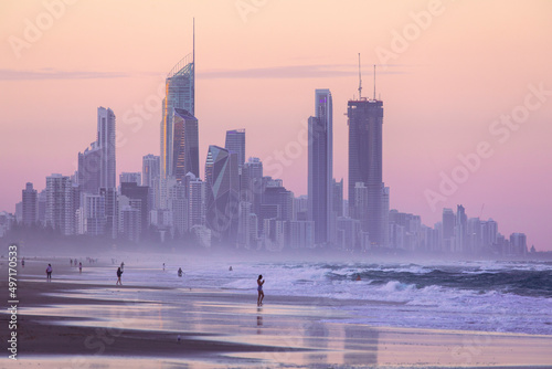 Gold Coast cityscape with people on Miami beach at sunset