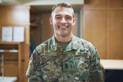 Theres confident and then theres military confident. Shot of a young soldier standing in the dorms of a military academy.