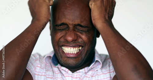Desperate African man close-up emotional stress reaction