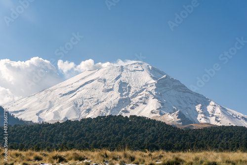 snow capped popocatepetl volcano with blue sky