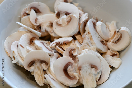 sliced quality White organic Mushrooms. plant based cooking ingredients. vegan and vegetarian cuisine. food preparation