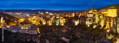 Panoramic illuminated picturesque city of Cuenca at dusk. Travel Spain