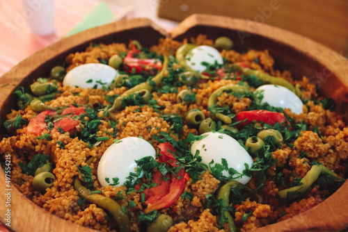 Closeup shot of Algerian traditional food in a wooden plate