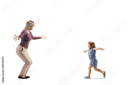 Full length profile shot of a child running towards mother