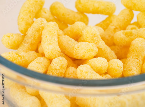 Close-up of Corn puffs in glass bowl