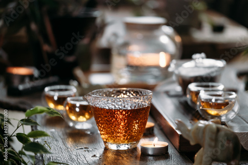 Beautiful chinese tea in teacup with candle flame decoration