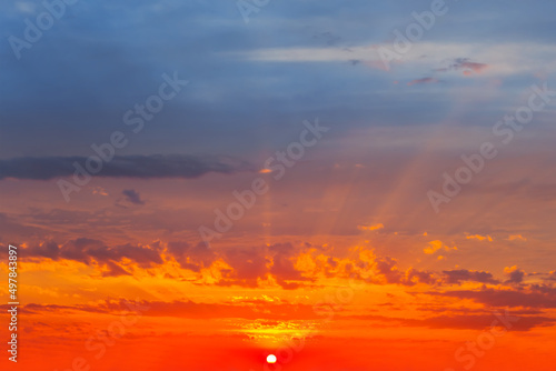 red dramatic sunset over cloudy sky, natural evening sky background