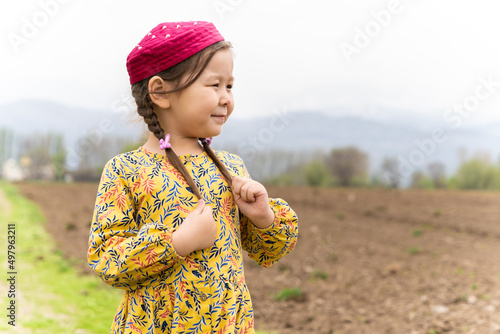 girl in a national headdress. Spring, Nowruz holiday. Kazakh girl. Central Asia, Kazakhstan.
