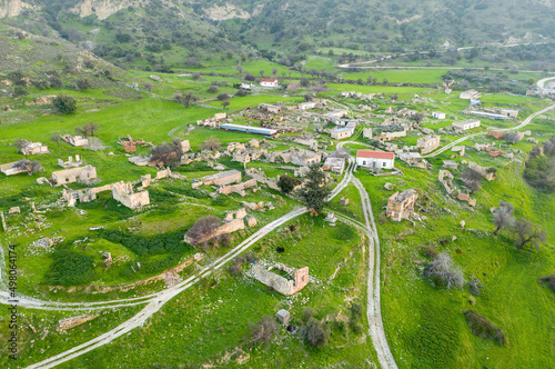 Rural depopulation in Cyprus. Abandoned village Souskiou in Paphos district, aerial landscape