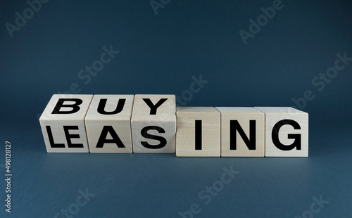 Leasing vs buy. Cubes form the choice words leasing or buying.