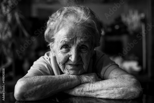 Portrait of an old woman. Black and white photo.