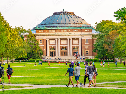 College students walk on the quad lawn of the University of Illinois campus in Urbana, Illinois