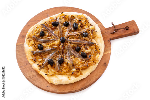 cooked pissaladière on a wooden board isolated on a white background