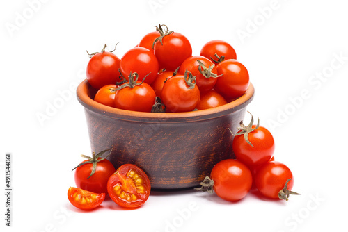 Group of cherry tomatoes in brown bowl isolated on white background.