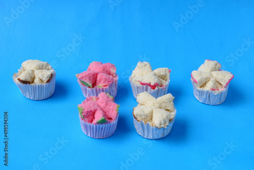 Steamed sponge cake, or bolu kukus food from Indonesia. isolated on a blue background