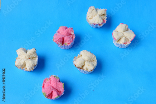 Steamed sponge cake, or bolu kukus food from Indonesia. isolated on a blue background