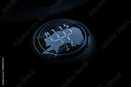 Closeup shot of the manual gear shifter isolated on dark background