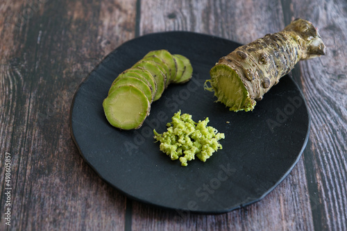 Plate of Japanese horseradish or wasabi on a wooden table