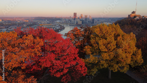 Beautiful view of a cityscape surrounded by colorful autumn trees in Pittsburgh, Pennsylvania
