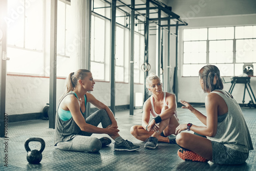 Their post-workout chats are essential. Shot of a group of young women taking a break together after a workout at the gym.