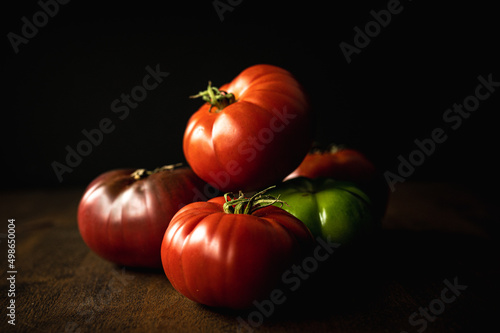 heirloom tomatoes on dark background
