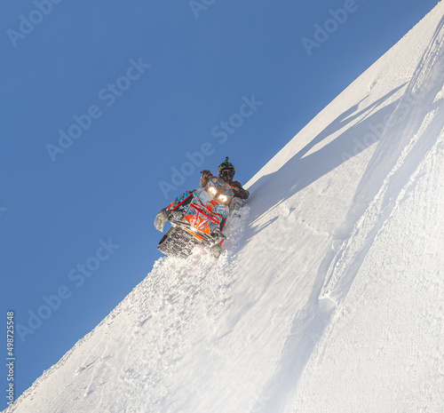 drift mountain snowmobile high in the mountains. photos for advertising and posters about professional tourism in winter on snowmobiles