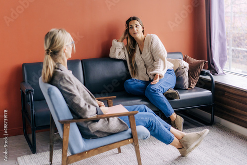 A female psychotherapist consults and gives advice and psychological support to a young woman.