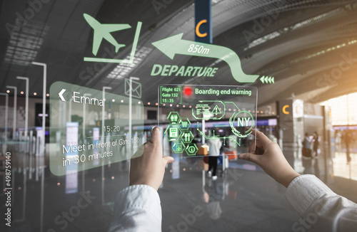 A woman receiving information using AR equipment at the airport (a hologram is displayed using a transparent acrylic plate)