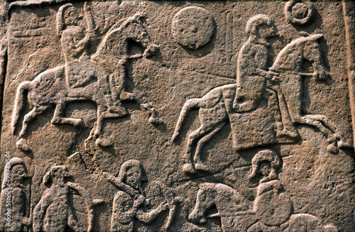 Celtic Pictish symbol stone slab detail in Aberlemno churchyard, Tayside, Scotland. Battle scene with horse cavalry and spearmen