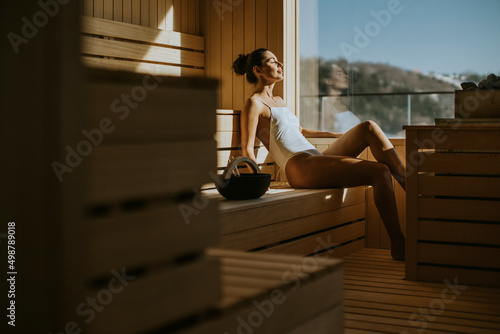 Young woman relaxing in the sauna