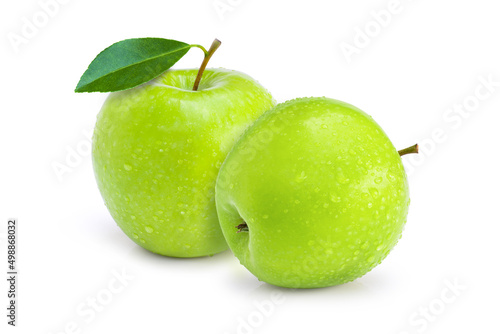 Two green granny smith apples fruit with leaf and water droplets isolated on white background.