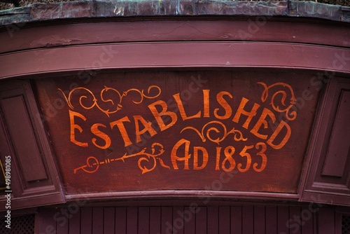 Established AD 1853 sign in red