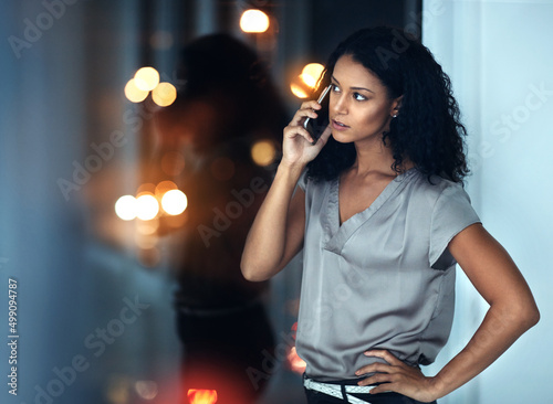 I dont want to hear excuses, just get it done. Shot of a young businesswoman talking on a mobile phone during a late night at work.